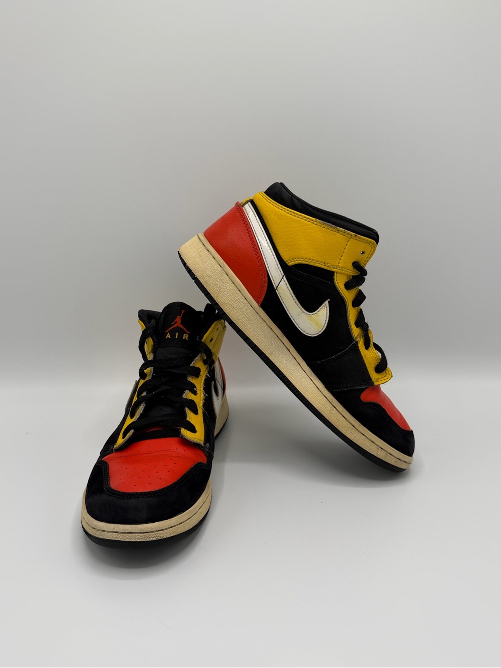 Jordan High-Top Sneakers in Black, Red & Yellow